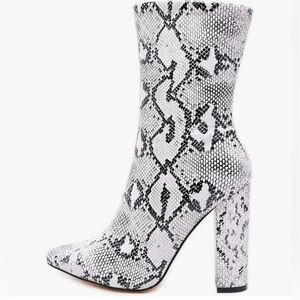 Size 8.5 Snake Print heeled boots.